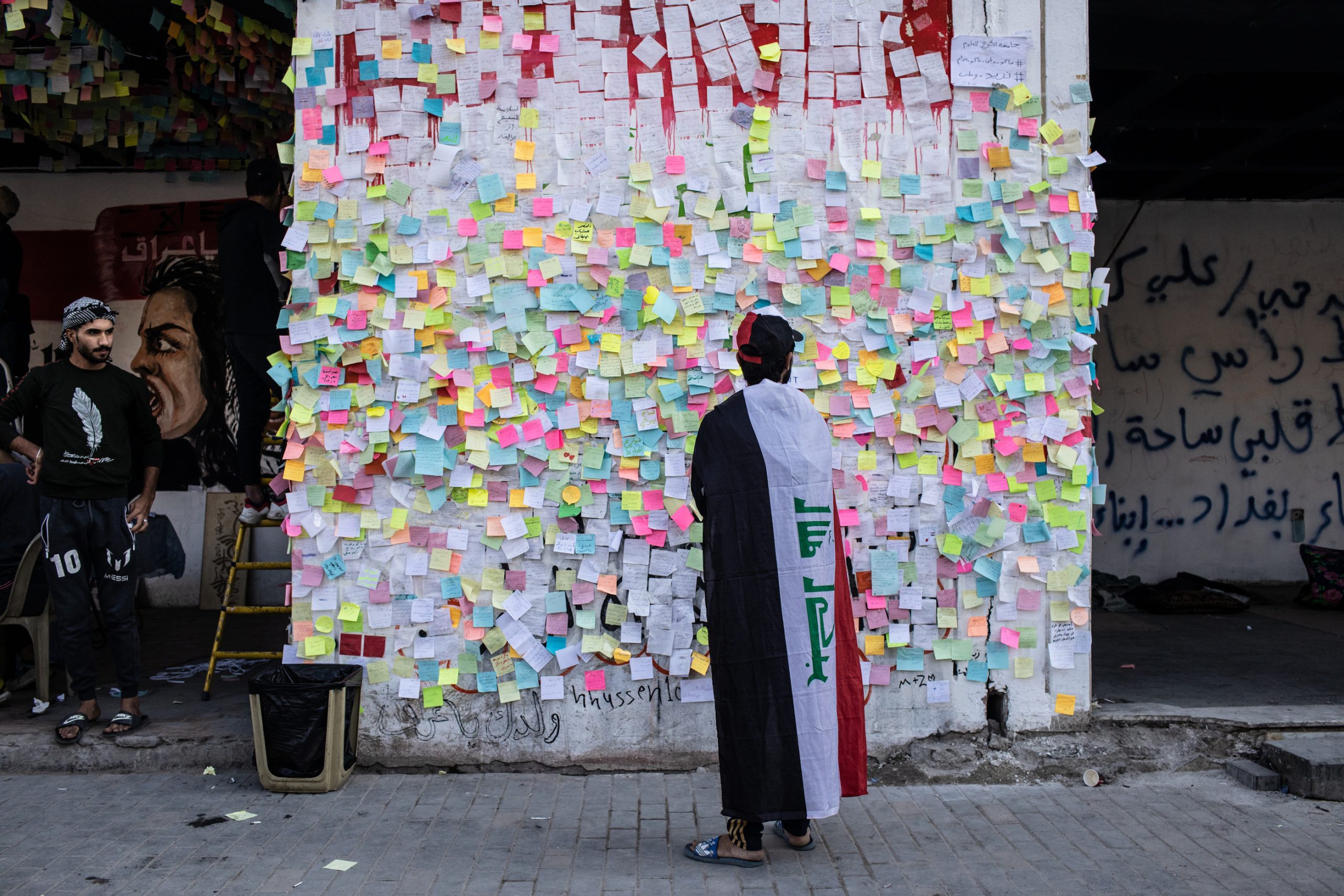 BAGHDAD, IRAQ - NOVEMBER 22:  Demonstrators pastes wishes on post-it notes on the 