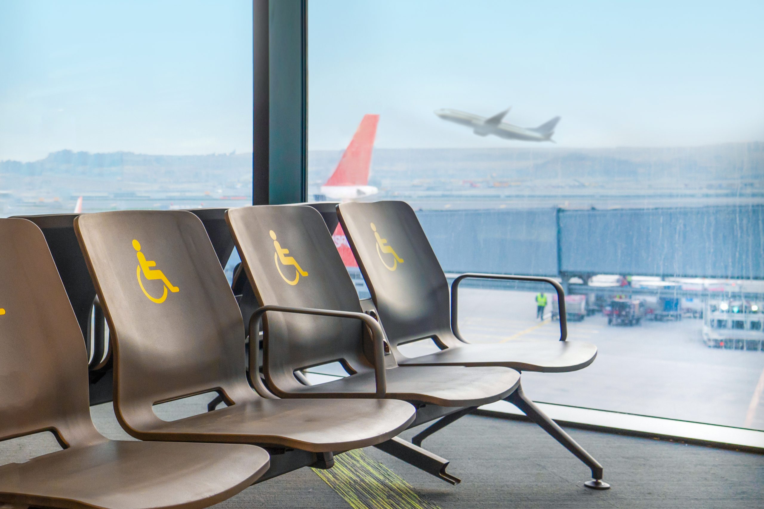 Empty disabled seats at an airport in the waiting area before boarding.