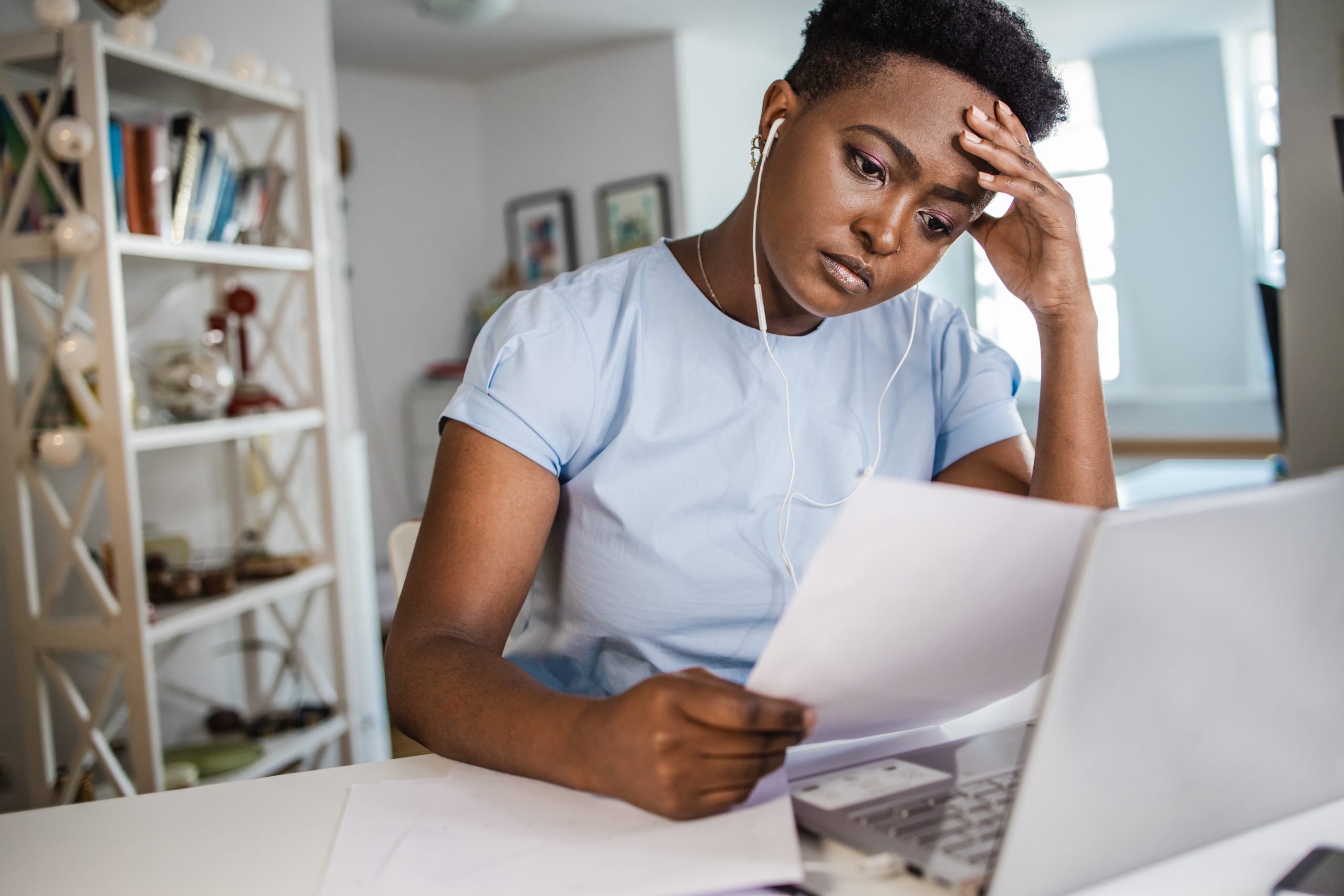 Woman feeling tired while working at home