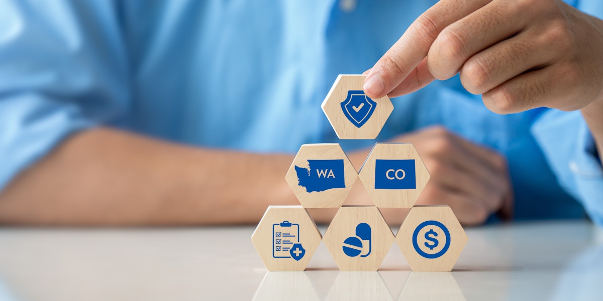 Person stacks up blacks that depict symbols commonly associated with healthcare