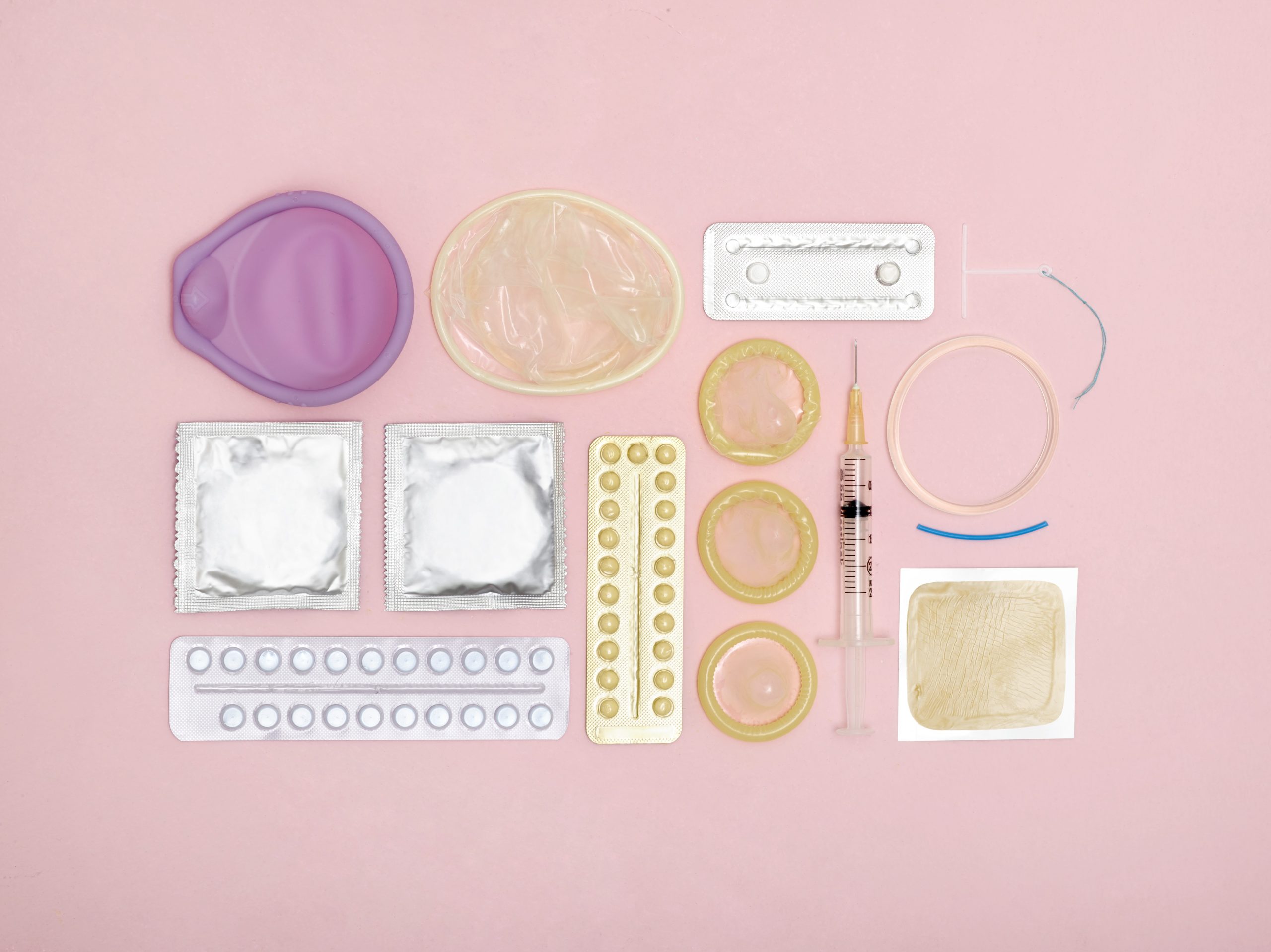 Contraception techniques against a pink background.